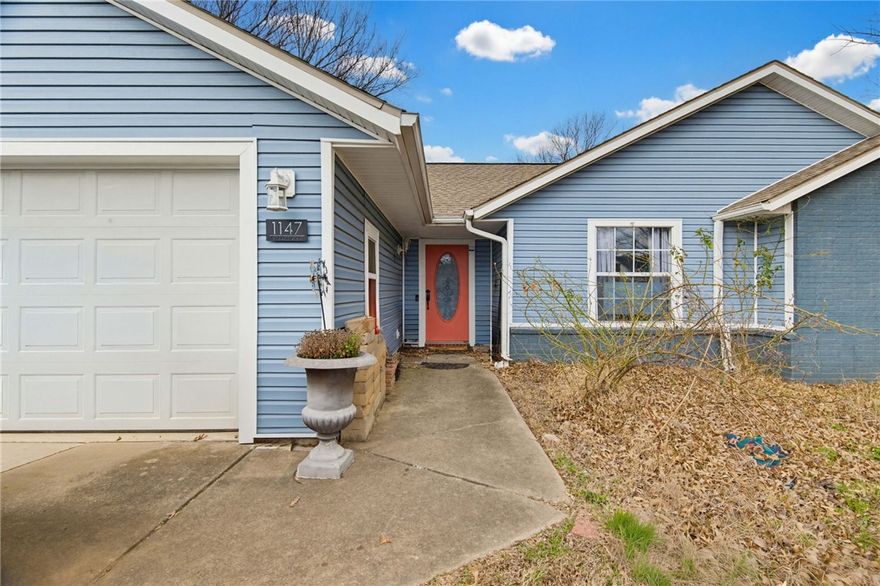 This 3 Bedroom 2 Bath home sits on a large lot off of Wedington. New water heater and HVAC in 2021.  New vinyl floors in 2025, as well as guest bathroom remodel, updated primary bath and kitchen countertops, too. New cedar fence in December 2025 - 3 year workmanship warranty.  Roof was installed in 2015.  New vinyl siding in 2023.  

The home has a large lot(0.26 acres), with room for kids and pets to play in the fenced yard.  It is close to bus routes(0.5 mile), as well as the greenway, and very close to I49, UofA, and major shopping and restaurants.  Many flower bulbs in the front yard that will bloom in the spring and summer.  Two outbuildings 10x10 wood from Holden Buildings in 2020 and a plastic 7x7 on treated wood foundation in 2023 for plenty of outdoor storage.   There is a hardwired Annke camera system with four cameras that will stay with the property.  
Take advantage of this convenient location and a preferred lender credit available up to $2800 for qualified buyers.