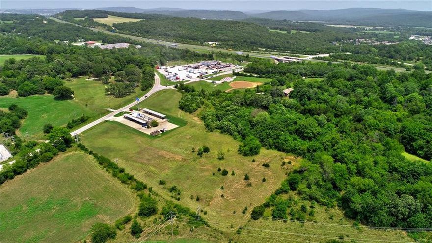 Fayetteville is expanding south into Greenland, and this 4.22 acres of prime commercially zoned property is ready to play a part. The region is exciting and growing and any number of enterprises can thrive on this land just off Interstate 49, including a wide range of commercial uses concerned with retail trade and consumer services; amusement and entertainment establishments; automotive and vehicular service establishments; transient sleeping accommodations; drive-in stores; eating and drinking places; financial institutions; and offices. Rolling green hills provide a picturesque setting, with nearby residential neighborhoods and Kessler Mountain Regional Park. With just quick drive up the I-49 to all that Fayetteville has to offer, this commercial land opportunity is golden!