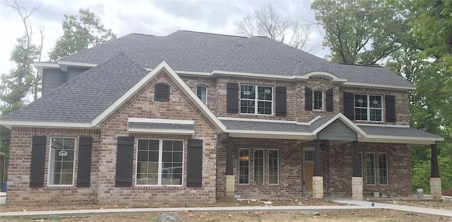 Southern style with a modern touch, this JSN Properties built home sits on a 2 acre corner lot. Exterior showcases oversized reclaimed brick pavers with a custom made iron door. Overlooking the backyard, the living room is lined with 2 walls of gorgeous windows. Powder bath allows access to the inside and outside of the home. Vaulted master bedroom with fireplace, his/her vanities, and a master closet with pocket door access into the laundry room. Upstairs offers a large playroom/gameroom with kitchenette and powder bath in hallway that leads into a separate media room. Overlooking the 2 acres, the back patio features a gas fireplace with inset for tv above.