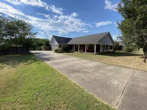 Comfort comes naturally to both friends and family in this cozy Contemporary. Kick back on the large wrap-around porch & admire the mature landscaping. Note the fenced back yard with large concrete pad for over size parking. The interior of this spacious home consist of 3-bedrooms, open living room, & eat-in kitchen. You really need to see this one - Call to make an appointment today!
