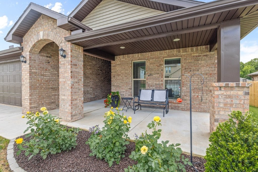 Pristine 3-bedroom home located in new Centerton subdivision. Enjoy coming home to your gourmet kitchen designed with both functionality and elegance, featuring quartz countertops, soft-close custom cabinetry and a large area for bar seating. Open concept LR/DR/Kitchen. Electric fireplace in living room. 10' high ceilings with crown molding. Relax in your spacious master bedroom with large en-suite including his and her vanities, soaker tub and separate shower. Large master walk-through closet connects to laundry room. Outside, you will want to spend time on both your front and back covered porches enjoying the beautifully manicured yard with three fruit trees. A must see!