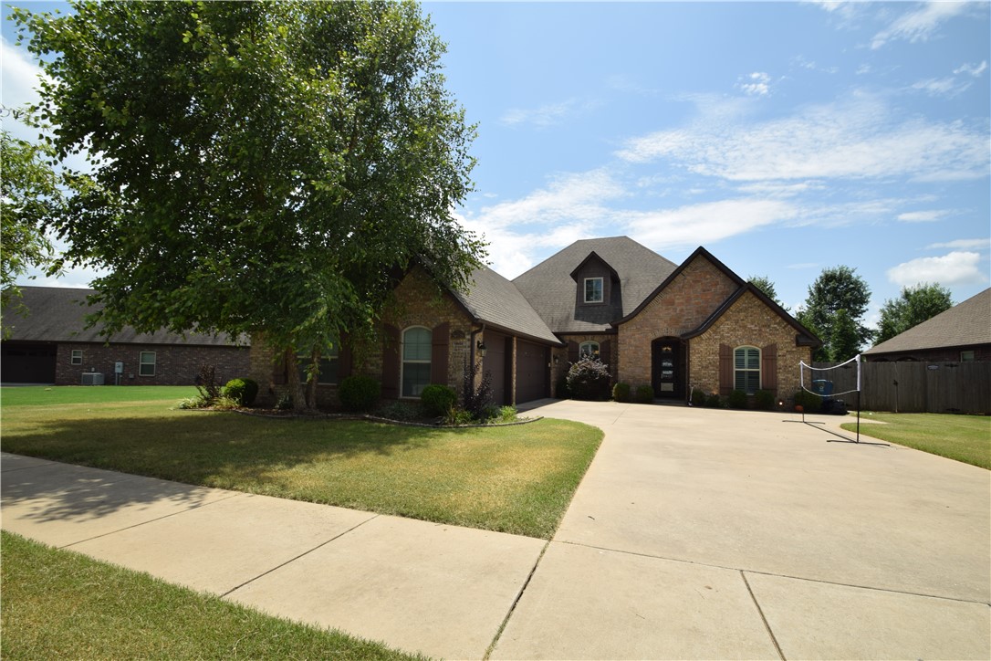 Welcome to this spectacular 4-bedroom, 3 bath home in Bentonville's North Fork Subdivision. The thoughtful design and upscale upgrades create a warm, inviting atmosphere. Step into the open living room featuring a cozy fireplace, leading to a dedicated office/library. The kitchen boasts upgraded appliances, granite countertops, and a spacious pantry. The master suite offers a unique pass-through closet to the laundry room. Home has a split floor plan with two additional bedrooms and a full bath conveniently located on the main level. Upstairs, enjoy a large living/media room, guest bedroom, and full bath. Relax year-round on the covered brick patio with an included hot tub. The professionally landscaped yard features a sprinkler system, and wood privacy fence. Home has a 3-car garage. No smoking, pets negotiable with owner approval.