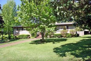 Cute home! 3 bedroom, 2 bath all on one level, with wood floors, gas log fireplace, large fenced back yard with covered patio. Basement, full, unfinished with 2 car garage doors and plenty of room for workshop area.