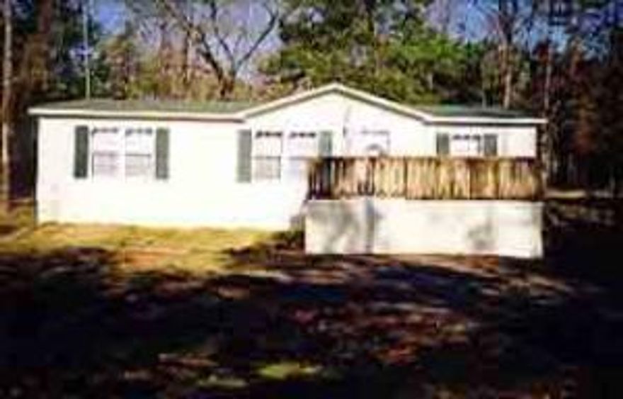THIS IS A WONDERFUL DOUBLE WIDE IN THE COUNTRY, IT IS THE LAST HOME ON THE RIGHT. IT HAS CEILING FANS IN ALL THE BEDROOMS AND TILT OUT WINDOWS. THEY ARE GOING TO HOOK UP TO RURAL WATER - THEY ARE ON A SHARED WELL RIGHT NOW.****W1/2 OF THE E1/2 OF THE