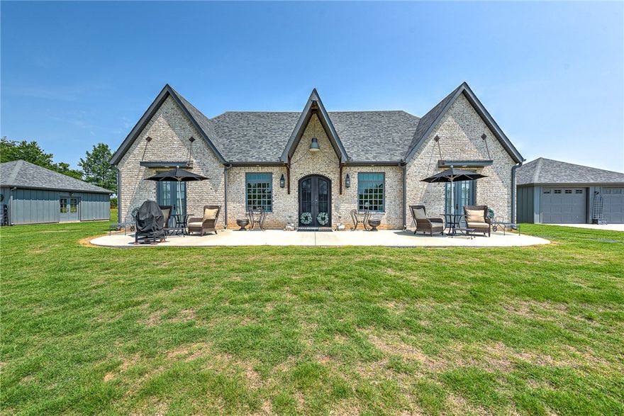 A one-of-a-kind property featuring a custom all brick home nestled on nearly 3 acres. This fabulous gentleman’s ranch is only 3 miles to Pinnacle Hills, 6 miles to XNA airport, and 7 miles to downtown Bentonville. The house features polished and sealed concrete flooring, upgraded cabinets, quartz countertops, upgraded stainless steel KitchenAid gas range with double ovens, and upgraded refrigerator and washer/dryer that convey. This energy efficient home offers upgraded spray foam insulation, a gas powered ceramic fireplace to warm you in the winter, and a tankless hot water heater with instant hot water! The Generac Home Generator will power the whole house! Enjoy scenic views from the oversized covered back porch with fabulous wood burning fireplace. Bedrooms include French doors that bring the outside nature inside. The 25ft x 25ft insulated barn will keep your pets warm and has a water hydrant & concrete pad for storage of horse tack, mowers & yard tools. Panels form a pasture for your horse or other animals.