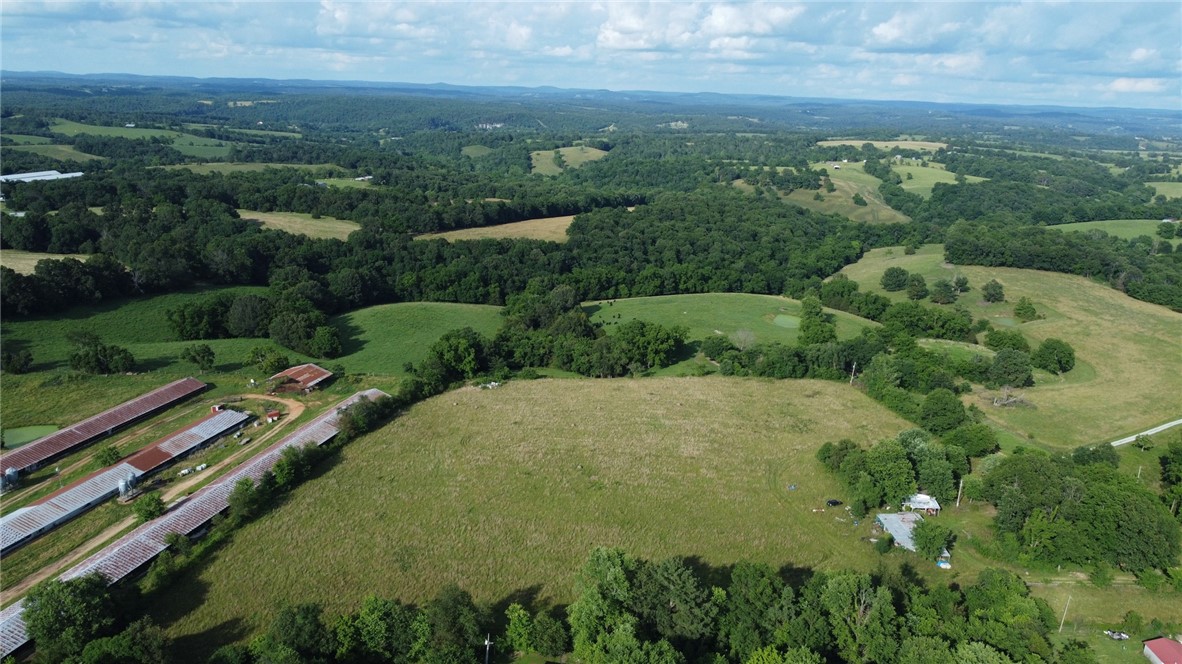 Discover the perfect blend of rural charm and convenience with this stunning 10-acre property in Madison County, Arkansas. Located near the historic community of Alabam, this parcel features mostly cleared hay pasture, a homestead or creating your dream mini-farm. Mature walnut and oak trees grace the landscape near the old homesite, offering both beauty and shade. Just a quarter mile off the blacktop, the property provides easy access while maintaining a sense of seclusion. Enjoy the tranquility of country living with a short 10-minute drive to Huntsville and only 35 minutes to the amenities of Springdale. The northeast-facing views are simply breathtaking, and the perimeter tree line ensures privacy and enhances the open feel of the land. This property is a rare find, offering a fantastic opportunity to establish a homestead or create a peaceful retreat. Embrace the natural beauty and endless possibilities that await on this exceptional piece of Arkansas land. The old homesite will remain in as/is condition.