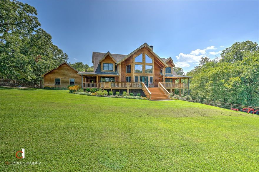 Magnificent Log Home! Custom Craftsmanship throughout make this home a One-Of-A-Kind! Beautiful views overlooking 11 acres, pipe fencing, 4 stall Morton Horse barn with automatic waters and swing feeders, tack room and workshop area. RV pad and hook up. Home has 3 levels, soaring beamed ceilings, tons of updates, 2 kitchens, 3 living areas, storage, and exercise room. 6 bedrooms, 5 baths, radiant heat, instant hot water and Generator. Come see all this gorgeous home has to offer in person today!