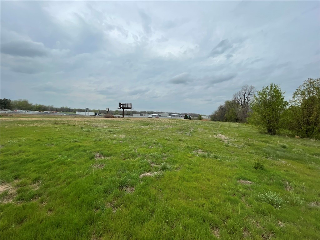 7.66+/- acres with I49 frontage zoned C2. Excellent development potential and ideal for hotel. Sellers will consider property trades. Agent Owned