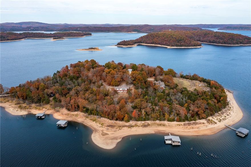 Truly a one of kind custom built lakefront home, welcome to Our Island! This never been on market lakefront, lakeview one owner home is packed with a punch, 2X6 construction, low maintenance, and well cared for over the years, built in 1999 and is a must see. Situated on a gorgeous 2.73 acres with 435ft of shoreline, beautiful bluffs, easy access to dock, is a custom 3,260 sqft home with 3 bedrooms, , office that could be 4th bedroom, 3 baths, multiple open living areas, mini kitchen in lower level, finished and heated and cooled spacious garage which is not included in square footage but could easily be converted into additional living space. Year round Ozark Mountain and Beaver Lake views, easy access to shared dock, road for access to shared dock or take a stroll down steps and bluffs, lift included with slip. Only 15 miles to Downtown Rogers, close to Hobbs State Park and trails, easily the most beautiful part of Beaver Lake. Seller will consider selling all slips, as private dock as well!