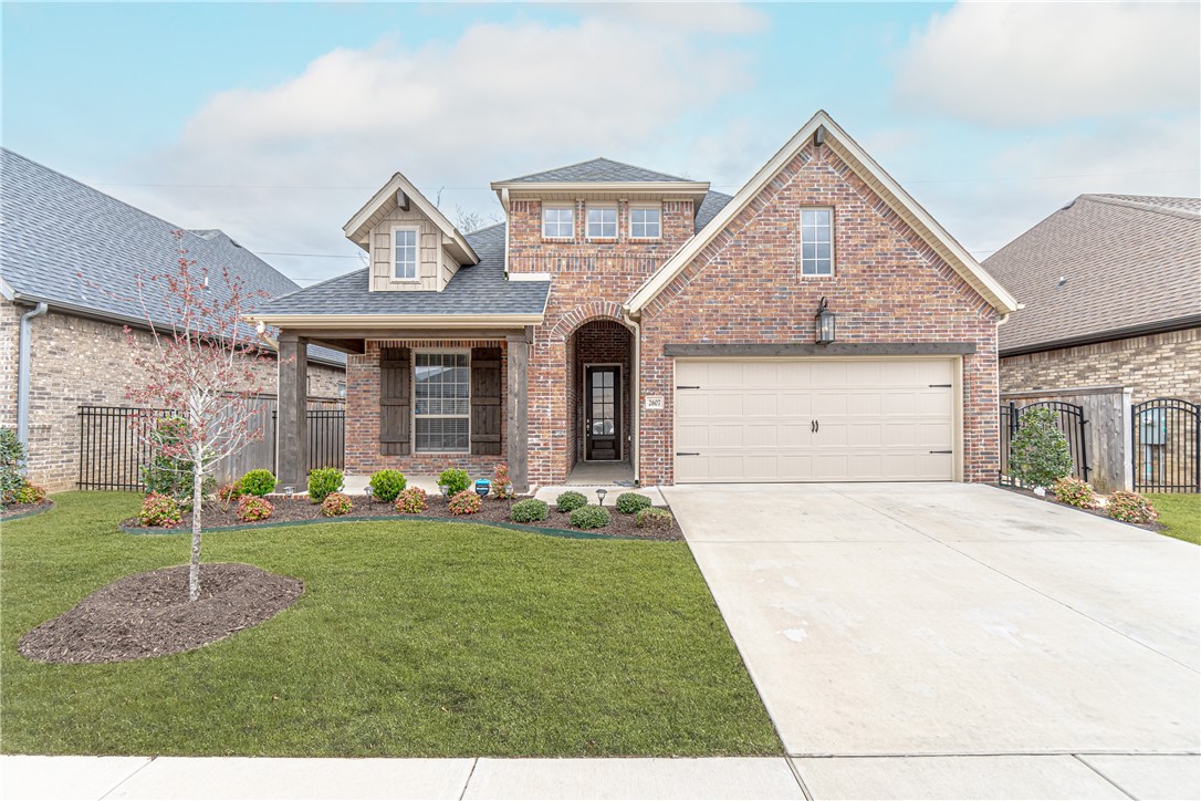 Beautiful brick home with craftsman style pillars in Bentonville! Living area features cozy, wood burning fireplace. Kitchen has white pearl quartz with white painted cabinets for that modern look. Hard wood, riverside doors, dining room chandeliers are just a few dazzling features of this home! Master suite has tray ceilings, soaker tub, walk in shower and double vanity. Backyard has large covered patio. Apply now at metrorentsnwa.com
