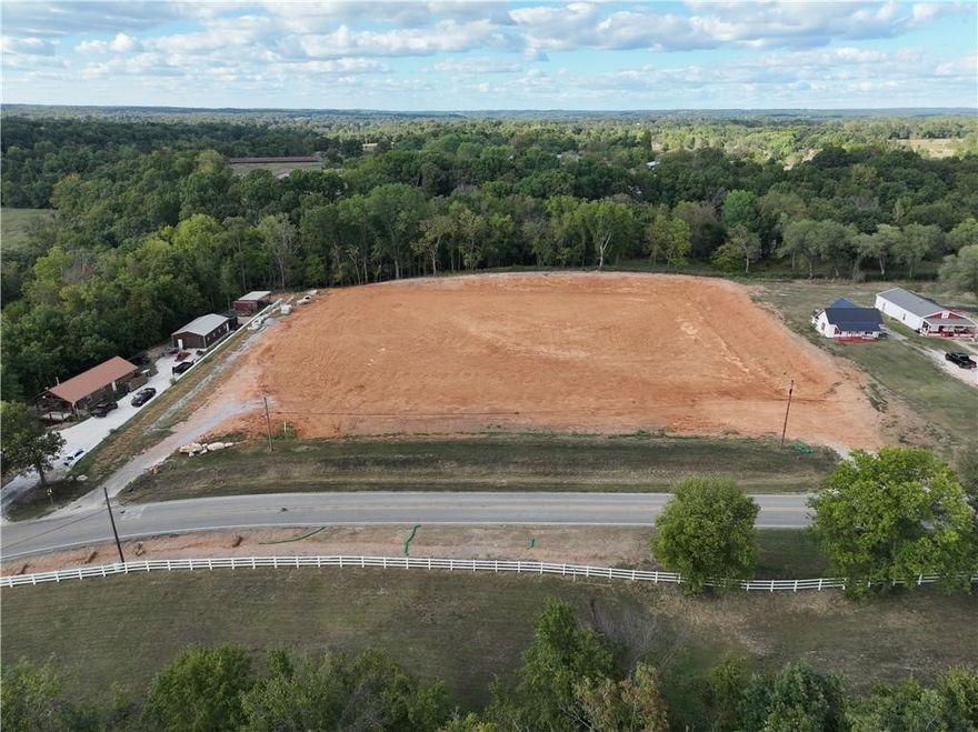 Unlock the potential of this prime 3.88-acre commercial lot with excellent road frontage in the growing community of Pea Ridge. This property offers a unique opportunity to establish your own business in a growing area, complete with essential utilities including public water, gas, electric, & sewer. Located just minutes from local amenities such as Walmart Neighborhood Market, Pea Ridge City Park, & Big Sugar Golf Club, this lot provides convenient access for customers & clients. Its strategic location ensures high visibility & traffic, making it an ideal site for retail, service, or office space. Zoned for multi family & has been conditionally approved for 40 townhomes. Also, approved for a trailer storage facility with approved engineered plans by the city. Don’t miss out on this opportunity to invest in a rapidly developing area. Make your mark in Pea Ridge today!