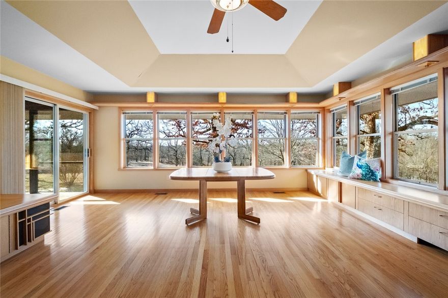 Discover Architectural Elegance & Natural Beauty in this Frank Lloyd Wright-inspired Retreat on 14 Picturesque Acres right near Town and Beaver Lake. Thoughtfully Designed & Built by owner Jerry LaBounty, who collaborated w architect E. Fay Jones to build Thorncrown Chapel, Cooper Chapel & other accolades (see attachments). This One-of-a-kind, Mid-Century Modern 2 BR, 2 BA Custom Home showcases Exquisite Craftsmanship, featuring Custom TrimWork, Rich Wood Accents & Seamless Indoor-outdoor Integration w Breathtaking Views. The Property boasts 2 serene Ponds, a Spacious 40’x60’ Shop w Wood-burning Stove & Half Bath, plus a second Barn. The Great Room features a Stunning Wall of Windows, Built-in Storage, Endless Views & Hidden Gun/Storage Closet, plus a Heated/Cooled Room in Garage. Enjoy the Rock Koi Pond w Fountain, Flagstone Patio by Kitchen, Screen Porch, Garden w electric fence, & water well for irrigation. A True work of Art- offering Serenity, Craftsmanship, & Timeless Design.