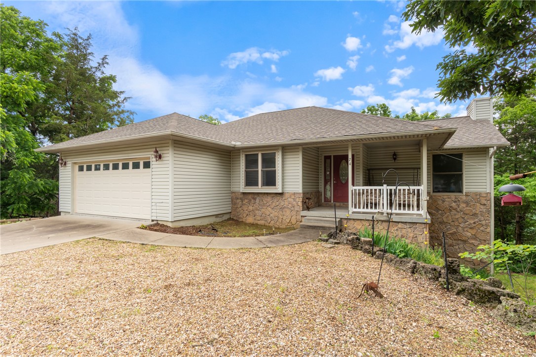 Surrounded by the natural beauty of Holiday Island, this 3 bed, 3 bath, 2,470 sq ft home captures breathtaking Ozark Mountain views & delivers a treehouse-like experience. Step inside to a spacious, thoughtfully designed layout with endless storage & multiple living areas to enjoy. The main level showcases a tall vaulted-ceiling living room with a gas fireplace, a flexible space for dining or an office, a large kitchen with warm oak cabinetry & a cozy breakfast nook leading to the back deck. The primary suite has a huge walk-in closet & a en suite bathroom featuring a double vanity, soaking tub & a separate shower. Downstairs, discover a second living area, kitchenette, 2 bedrooms, & access to a large lower deckāideal for guests or multi-generational living. Enjoy the outdoors with a large backyard perfect for gardening, plus an oversized garage for added utility. Located just minutes from Table Rock Lake Marina & Holiday Islandās amenities including the recreation center with the pool, golf course, tennis & more.