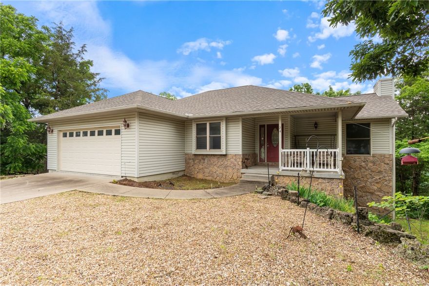 Surrounded by the natural beauty of Holiday Island, this 3 bed, 3 bath, 2,470 sq ft home captures breathtaking Ozark Mountain views & delivers a treehouse-like experience. Step inside to a spacious, thoughtfully designed layout with endless storage & multiple living areas to enjoy. The main level showcases a tall vaulted-ceiling living room with a gas fireplace, a flexible space for dining or an office, a large kitchen with warm oak cabinetry & a cozy breakfast nook leading to the back deck. The primary suite has a huge walk-in closet & a en suite bathroom featuring a double vanity, soaking tub & a separate shower. Downstairs, discover a second living area, kitchenette, 2 bedrooms, & access to a large lower deck—ideal for guests or multi-generational living. Enjoy the outdoors with a large backyard perfect for gardening, plus an oversized garage for added utility. Located just minutes from Table Rock Lake Marina & Holiday Island’s amenities including the recreation center with the pool, golf course, tennis & more.