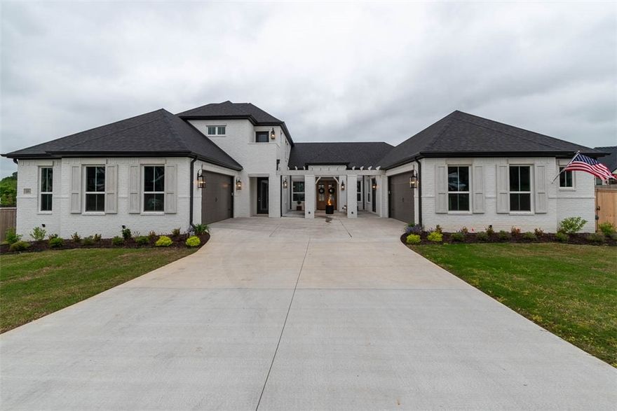 Sold/pending before print.  5 bedrooms (3 on main level, each with ensuite bathrooms.  2 upstairs) + office + game/bonus room + media room.  4.5 bathrooms total.  White oak wood flooring.  Upgrades: Kitchen cabinets go up to the ceilings, enlarged primary shower with dual shower heads, upgraded appliances including ice maker and sub zero fridge/freezer, 8' tall door ways, extra large lanterns on exterior, motorized roman shades in living room, great room, and primary bedroom, custom closet remodel that includes a secret safe room, 4 car epoxied garage, and so much more!