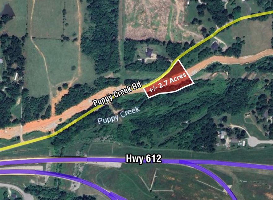 Build Your Dream home on +/- 2.7 acres offering excellent potential for residential development! This property is in the heart of beautiful Northwest Arkansas, close to all amenities: less than 5 minutes to JB Hunt Corporate HQ, less than 10 minutes to Pinnacle Hills Promenade Mall, restaurants, shopping, I-49, 11 minutes to XNA airport, and less than 5 minutes to the new 612. This property has a wooded feel and backs up to a beautiful creek. A +/- 5,000 sf home could be built here, depending on buyers perc test results. The back of the lot is in the flood zone, ideal building spot is to the north side. Lot is still subject to splitting approval with City of Lowell, but verbal conversations have been had and city seems receptive to the split. Septic may be ideal, but sewer line is in Puppy Creek - access to be approved by Lowell/Springdale. It is a Springdale Sewer Line but Lowell Administers it. Buyer would also need a well, but water is on the property to the south so could possibly be negotiated to come north.