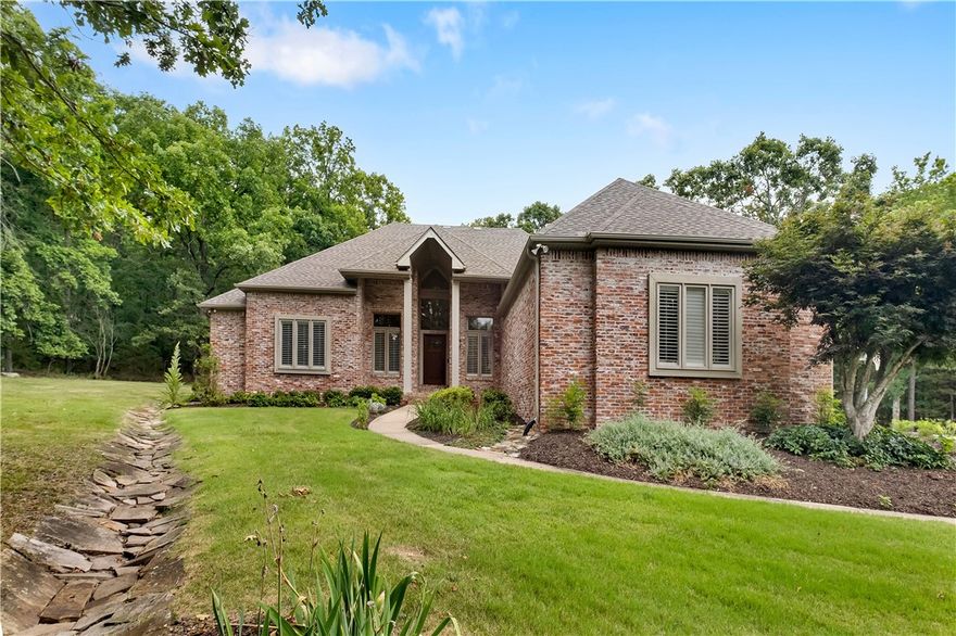 Welcome to your own private oasis on Fayetteville's East side! This beautiful home is situated on 3.6 acres of wooded land, giving you plenty of privacy while still being located less than 2 miles from schools, dining, and shopping. Step into the warm and inviting living/dining room. The open kitchen room provides a casual atmosphere. Completely updated appliances in the kitchen make cooking joyous and enjoyable also with a coffee bar. This 4 bed, 4.5 bath home is perfect if you need extra space, as each bedroom has its own attached private bathroom - including the large master which is located  downstairs along with one secondary bedroom. Upstairs you will find two large bedrooms - plus two more bathrooms! No shortage of storage either; this house comes complete with an pantry and
utility room, bright and cherry sunroom and a large bonus room.