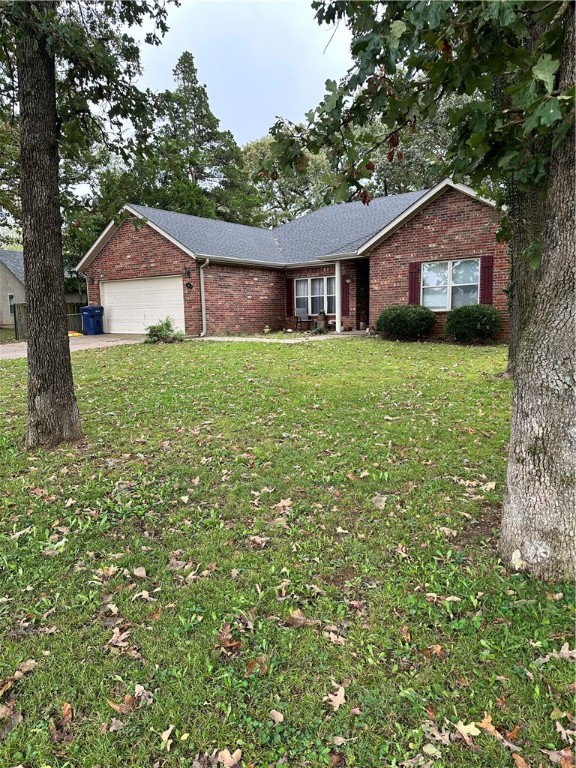 This charming all brick home is ready for you! Nestled back in the trees, it is so peaceful while still being close to all the amenities town has to offer. This home has 3 bedrooms on one side with the master bedroom being on the other side of the home for additional privacy. Master bedroom has more space than is pictured with fantastic windows overlooking the backyard. Primary bath has separate tub and shower, double sinks, linen closet, and oversized closet. Large closets throughout the home are great for storage! Formal dining room with an open concept feel is great for entertaining. Kitchen boasts plenty of counter space as well as a pantry and eat-in space for a table and chairs and/or bar stools. Spacious yard with extended driveway leaves plenty of room for the whole family. Enjoy your fireplace in your cozy living room this winter. You will love the feel of pulling up to this wonderful home! A few little touches will make it your own. New roof, gutters, and hot water tank in 2025.