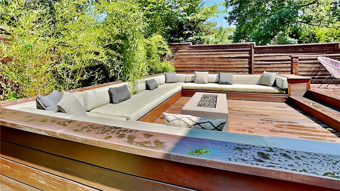 Welcome to 6505 W Alyssa Lane, this unique 4-bedroom, 3.5-bath stunning home is central to everything NWA has to offer. This 4,172 sq ft residence boasts a spectacular backyard oasis featuring imported Ipe wood decking, a Jacuzzi hot tub, and a sunken fire pit with built-in seating. Enjoy seamless indoor-outdoor living with panoramic doors, a lower-level wood-burning fireplace, direct-connected gas grill, outdoor dining, and TV hookups under a charming cedar pergola. Inside, discover hardwood flooring, a spacious gourmet kitchen with gas cooktop, granite countertops, and custom cabinets, plus a convenient butler's pantry leading to the formal dining. The first floor includes a large primary suite alongside a private office with custom built-ins. A gorgeous spiral staircase leads to additional bedrooms and a versatile bonus room or fourth bedroom. With a 3-car garage, outstanding curb appeal, and close proximity to Pinnacle Promenade, The AMP, dining, and I-49, this home offers unparalleled luxury and convenience.