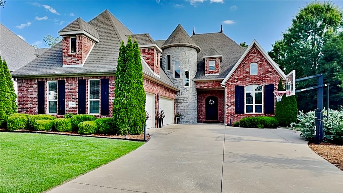Welcome to 6505 W Alyssa Lane, this unique 4-bedroom, 3.5-bath stunning home is central to everything NWA has to offer. This 4,172 sq ft residence boasts a spectacular backyard oasis featuring imported Ipe wood decking, a Jacuzzi hot tub, and a sunken fire pit with built-in seating. Enjoy seamless indoor-outdoor living with panoramic doors, a lower-level wood-burning fireplace, direct-connected gas grill, outdoor dining, and TV hookups under a charming cedar pergola. Inside, discover hardwood flooring, a spacious gourmet kitchen with gas cooktop, granite countertops, and custom cabinets, plus a convenient butler's pantry leading to the formal dining. The first floor includes a large primary suite alongside a private office with custom built-ins. A gorgeous spiral staircase leads to additional bedrooms and a versatile bonus room or fourth bedroom. With a 3-car garage, outstanding curb appeal, and close proximity to Pinnacle Promenade, The AMP, dining, and I-49, this home offers unparalleled luxury and convenience.