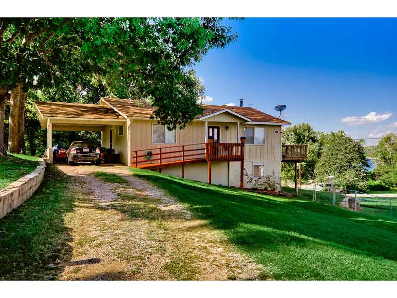 This is a must see! Year round Beaver Lake views. Sellers have just remodeled the basement plus they have installed all new flooring, paint, and trim in the house. 3 bedrooms, 3 living areas, 2 full baths, a large eat in kitchen with a spacious pantry,new dishwasher, & gas range. Sitting on 3 lots, with 2 decks. Walking distance to public beach and boat launch.