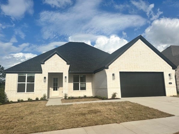 Princeton 4 Plan in Henderson Park, our newest Community located in Fayetteville! These homes will be 4-sided Brick. The Kitchen will have an oversized kitchen island, quartz countertops and 42-inch upper cabinets with top molding with an Upgraded Stainless steel appliance package. The Living room will have a Beautiful Gas Fireplace. LED lighting throughout! 2-inch blinds throughout! Ceiling fans! High efficiency air conditioner system with Programmable WI-FI thermostat! Tankless hot water heater! Bedroom one will have double sinks, oversized walk-in shower, and a SOAKING TUB!! Covered Patio! Gutters included! Springdale Schools. Taxes TBD.