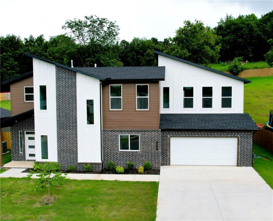 Seller offering $10,000 in buyer concessions! Welcome to this 4-bedroom, 3-full-bath new modern home nestled within the Sugar Creek Golf Course area. Move-in ready, this residence offers a 1-year family golf membership, perfect for golf enthusiasts! As you step inside, you'll be greeted by an open floor plan that seamlessly connects the main living areas. The spacious kitchen features a large island, ideal for entertaining guests and family gatherings. Durable luxury vinyl plank flooring, soft carpet, and elegant tile adorn the home.
The main level boasts one bedroom and a full bath, while the upper level offers three additional bedrooms, including a generous bonus room, perfect for play or relaxation. Enjoy the convenience of two full bathrooms upstairs, ensuring ample space for everyone.
With vaulted ceilings and an abundance of natural light, this home strikes the perfect balance between modern elegance and comfortable living. Some images in the listing have been virtually staged.
