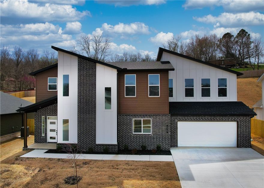 Seller offering $10,000 in buyer concessions! Welcome to this 4-bedroom, 3-full-bath new modern home nestled within the Sugar Creek Golf Course area. Move-in ready, this residence offers a 1-year family golf membership, perfect for golf enthusiasts! As you step inside, you'll be greeted by an open floor plan that seamlessly connects the main living areas. The spacious kitchen features a large island, ideal for entertaining guests and family gatherings. Durable luxury vinyl plank flooring, soft carpet, and elegant tile adorn the home. 
The main level boasts one bedroom and a full bath, while the upper level offers three additional bedrooms, including a generous bonus room, perfect for play or relaxation. Enjoy the convenience of two full bathrooms upstairs, ensuring ample space for everyone.
With vaulted ceilings and an abundance of natural light, this home strikes the perfect balance between modern elegance and comfortable living. Don’t miss your chance to own this gem in Pea Ridge—schedule your showing today!