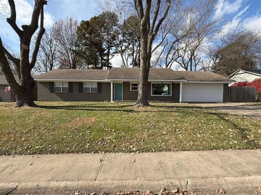 Remodeled 3 bed 2 bath home in the heart of Springdale! Hardwood floors throughout. Eat in kitchen with SS appliances. Refrigerator provided. Large living room with wood burning fireplace overlooking large, wooded fenced backyard. Remodeled bathrooms and two car attached garage. Apply at PrimeNWA.com