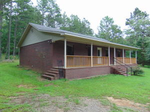 Brick home located just minutes from town that includes 5.52 acres. This 3 bedroom 2 bath features large living room and kitchen, split floor plan with walk in closet in master bedroom, new paint throughout the home, large laundry room sits just of of the kitchen, outside is lots of mature trees provide lots of shade, covered porch with 2 sets of steps, nice quite location at the end of the lane. this could be the one for you