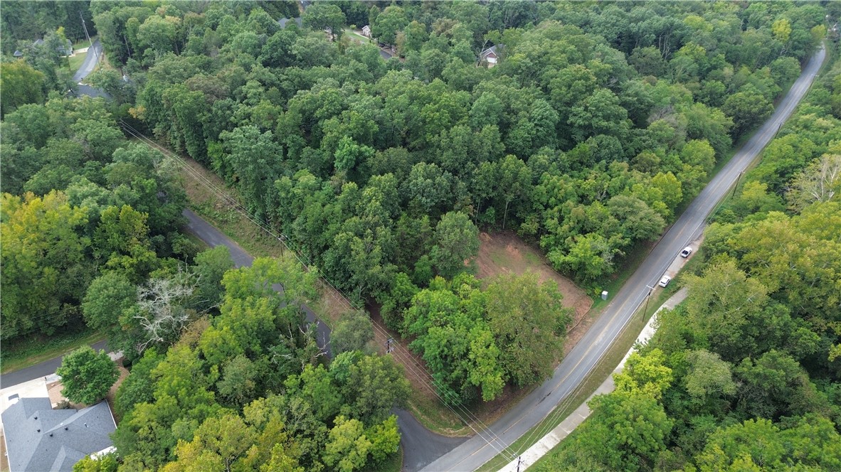 Beautiful .36-acre lot in Bella Vista, partially cleared and ready for your dream home. Nestled between Metfield and Blowing Springs and located directly across from scenic trails, this buildable property offers entry access from either Warrick or Manchester and has utilities available on-site. Enjoy the perfect combination of convenience and privacy in one of Bella Vista’s desirable locations—whether you’re looking for easy trail access or a peaceful retreat, this lot has it all. More Pics and Drone coming.
