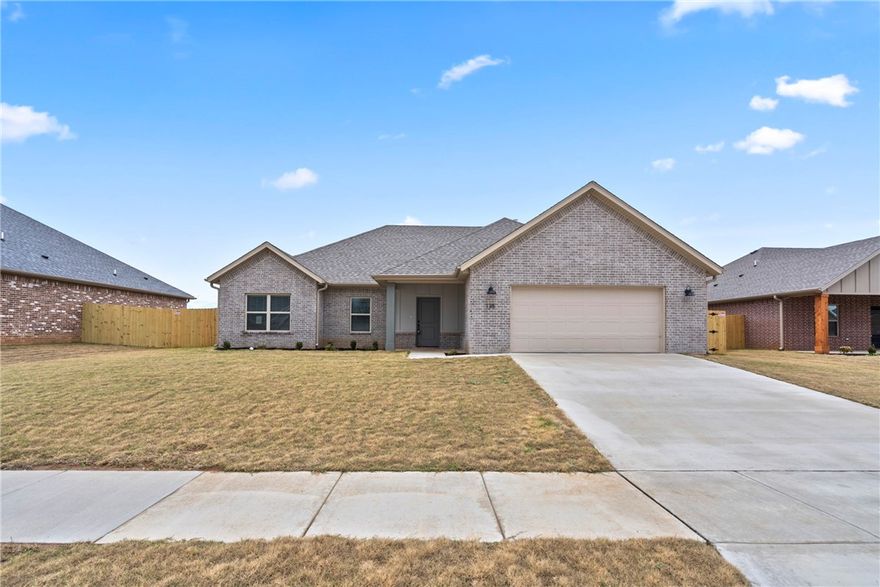 Beautifully crafted new build offering an airy open floor plan with vaulted ceilings, durable wood-look tile, and a welcoming gas fireplace. The kitchen impresses with sleek granite countertops, stainless steel appliances including a gas range, a bold island with bar seating, and a classy tile backsplash. The private primary suite highlights a tray ceiling, spa-inspired bath with dual sinks, soaking tub, a fully tiled shower, and a generous walk-in closet. Outside, enjoy a covered patio and fully fenced yard—complete with blinds, gutters, and a two-car garage