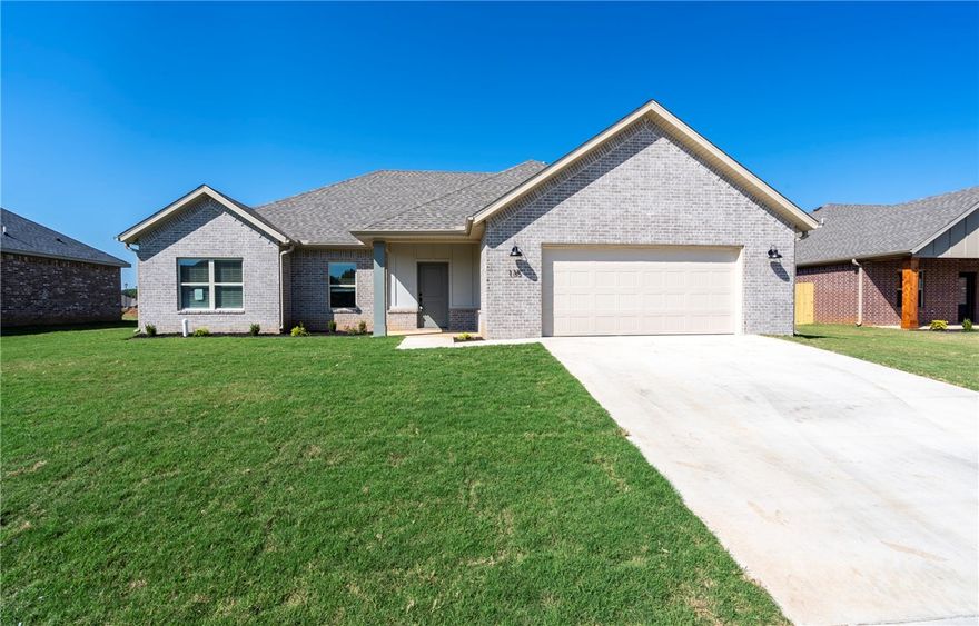Beautifully crafted new build offering an airy open floor plan with vaulted ceilings, durable wood-look tile, and a welcoming gas fireplace. The kitchen impresses with sleek granite countertops, stainless steel appliances including a gas range, a bold island with bar seating, and a classy tile backsplash. The private primary suite highlights a tray ceiling, spa-inspired bath with dual sinks, soaking tub, a fully tiled shower, and a generous walk-in closet. Outside, enjoy a covered patio and fully fenced yard—complete with blinds, gutters, and a two-car garage