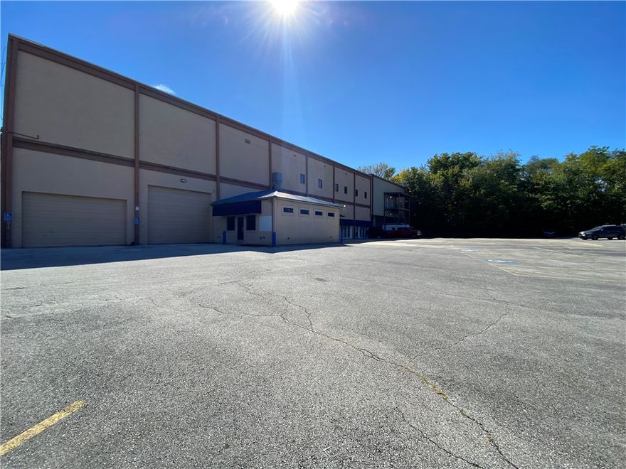 Centrally located along N. College Avenue, this property offers excellent exposure with 33,000 vehicles per day, convenient ingress and egress, and UC (Urban Corridor) zoning accommodating a wide range of commercial uses. Just minutes from Hwy 71B (1-mi.), I-49 (1.6-mi.), and downtown Fayetteville, this location is excellent for both local and regional operations. 

The 11,148-square-foot office/warehouse suite includes 4 roller doors (two 9'11", one 14', and one 6'11"), with approximately +2,500-square-foot heated and cooled office/showroom. The warehouse features clear heights of approximately 16'11" and built-in heaters. The warehouse naturally maintains a comfortable temperature year-round due to its placement against the hillside, offering operational efficiency and comfort. This space is ideal for businesses needing a balance of functional warehouse space and modern office accommodations in a prime, central location. Minimum divisible space is 4,000 square feet.