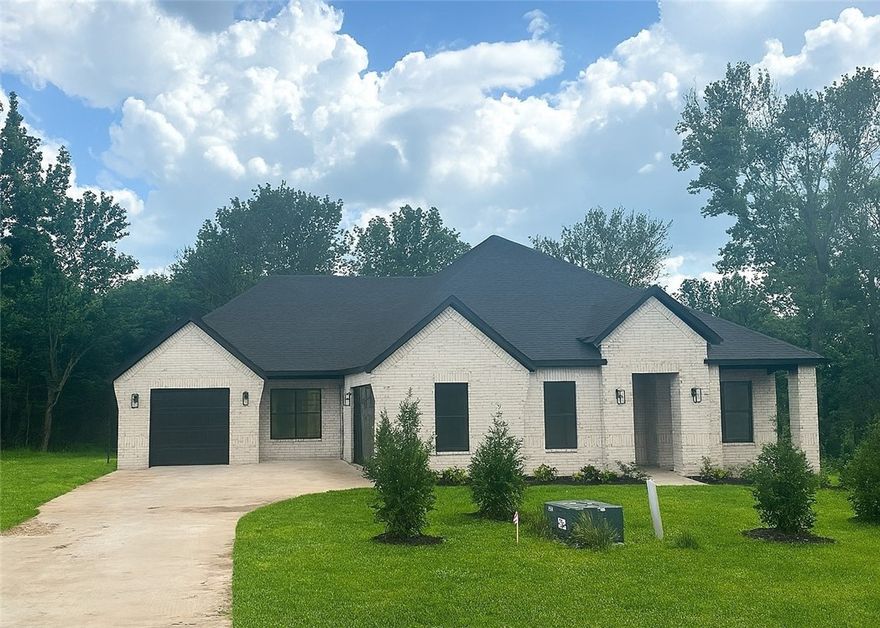 Exquisite Eliana plan - 4 Bedroom, with a Study, Dining AND also a fabulous Tech center, 3 Bathroom and a 3 Car Garage!  Side covered patio off the kitchen nook area as well as a large back patio! 
Luxurious Bedroom One with a fabulous en suite bathroom with a Walk-in Shower and Soaking Tub.  Kitchen boasts cabinet to ceiling cabinets, quartz counters, farmhouse sink and Kitchen Aid Stainless Steel Appliances with double ovens!  Black fixtures! LED Lighting! Ceiling fans!!  Mix of Brick and Hardie board exterior per plan. Asher's Ranch is an idyllic community nestled in the heart of Goshen, Arkansas, known for its picturesque landscapes and serene surroundings. The community boasts meticulously designed and built homes that are situated on expansive lots, with ample space for outdoor activities, gardening, and privacy. The homes are crafted to perfection, featuring modern amenities and elegant finishes that exude luxury and comfort. Come to Asher's Ranch and find your dream home today! Taxes TBD.