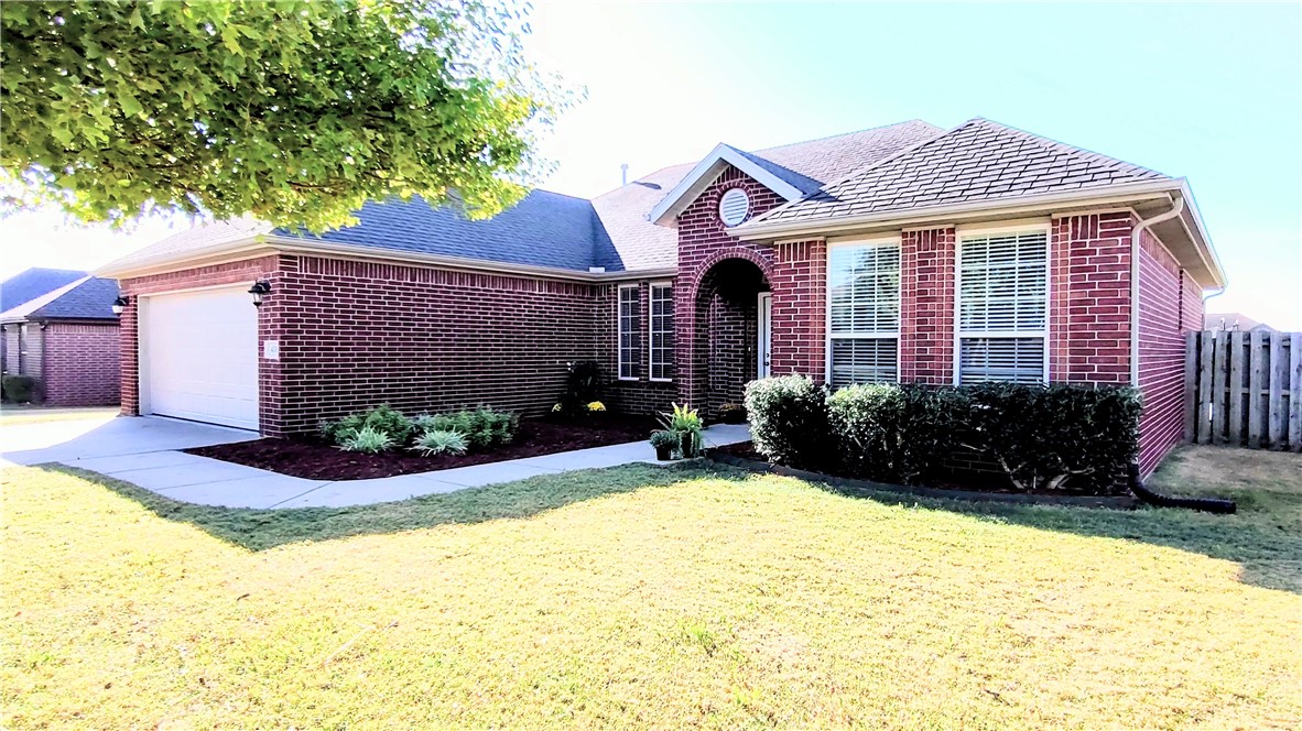 Wonderful brick home with 1650 SQFT in the Bentonville school District. The home has a split floor plan with 3 bedrooms and 2 bathrooms. This home boasts 9-foot ceilings with tray accents and abundant natural light. The home features arched entries, granite countertops, tile floors, and crown moulding. Amenities include a community clubhouse, playground, exercise room, and pool. Picture 450 Torino Place as your perfect new home. There is a $2,000.00 allowance for new carpet.