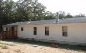 Very large manufactured home sitting on 18.59 acres a short drive to beautiful Bull Shoals Lake. If you are looking for abundant wild life and seclusion, this is the property for you.