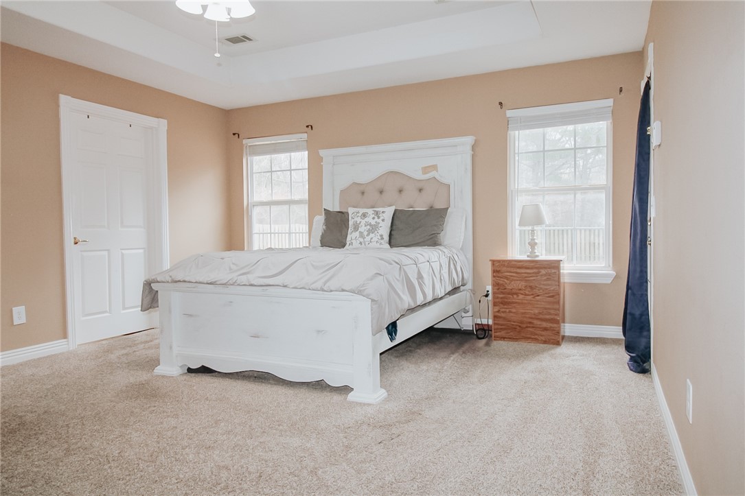 Great for a growing family, this home offers easy access to everything. Just minutes from downtown and John Brown University, with nearby parks and recreational areas. It features multiple dining spaces, an open living room, and a convenient laundry/mudroom off the garage. The primary ensuite has a separate shower and soaking tub. The fully fenced backyard backs to a serene wooded area for privacy. A storage shed can be converted into a workshop. Home to be sold as is. Schedule a Showing Today!