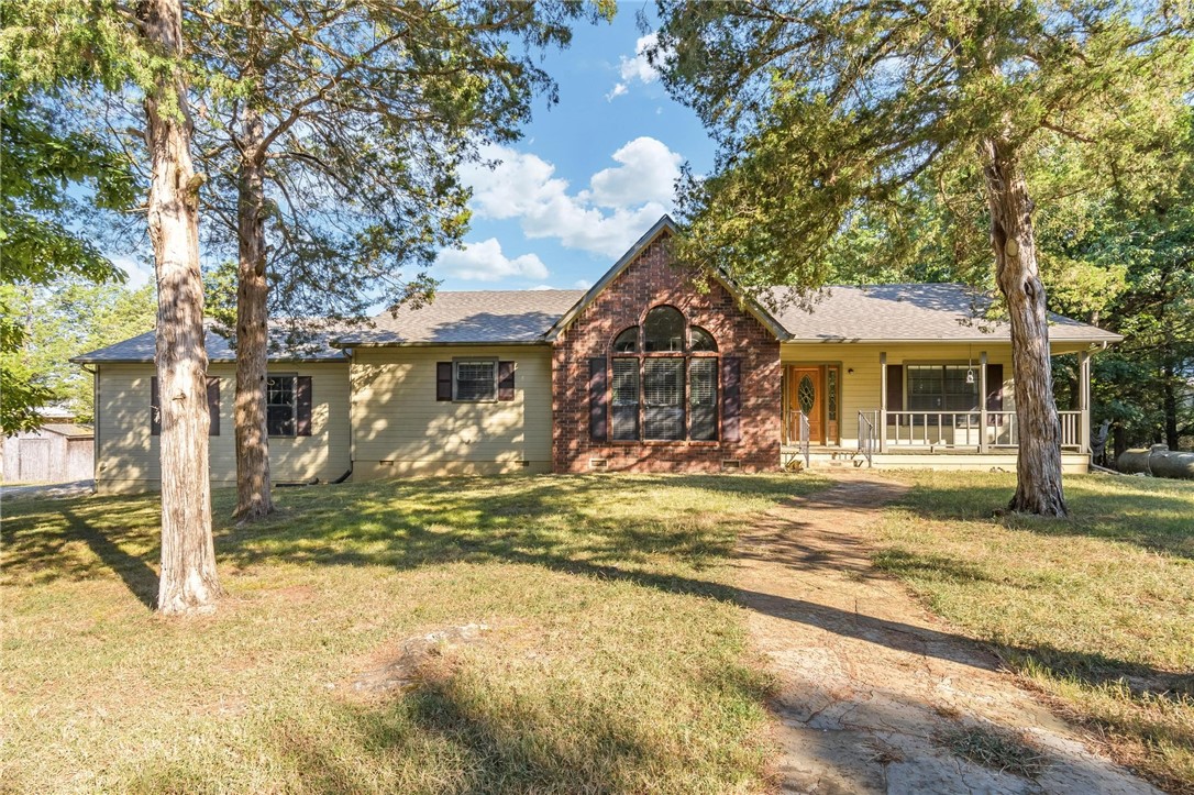 Here is your chance to wake up to a gorgeous view of Beaver lake with a gentle slope to 250 feet of shoreline on 2.00 acres of serenity. This custom built home has a large living room with cathedral ceilings, wood flooring, wood burning fireplace, 3 bed, 2 bath, split floor plan, oversized insulated 2 car garage with a receptacle for RV, and a large deck that overlooks the lake. Updates include new roof 2025, furnace 2025, patio doors 2025, toilets 2024, sinks/faucets 2018, hot water heater 2018, appliances 2018, countertops 2018, paint exterior 2018, interior paint 2024, carpet 2018. Property is located just a few minutes from Rocky Branch marina. Don't miss this incredible opportunity to live on the lake.