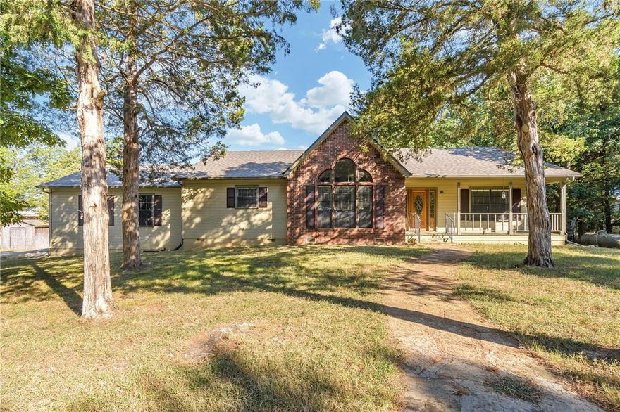 Here is your chance to wake up to a gorgeous view of Beaver lake with a gentle slope to 250 feet of shoreline on 2.00 acres of serenity. This custom built home has a large living room with cathedral ceilings, wood flooring, wood burning fireplace, 3 bed, 2 bath, split floor plan, oversized insulated 2 car garage with a receptacle for RV, and a large deck that overlooks the lake. Updates include new roof 2025, furnace 2025, patio doors 2025, toilets 2024, sinks/faucets 2018, hot water heater 2018, appliances 2018, countertops 2018, paint exterior 2018, interior paint 2024, carpet 2018. Property is located just a few minutes from Rocky Branch marina.   Don't miss this incredible opportunity to live on the lake.
