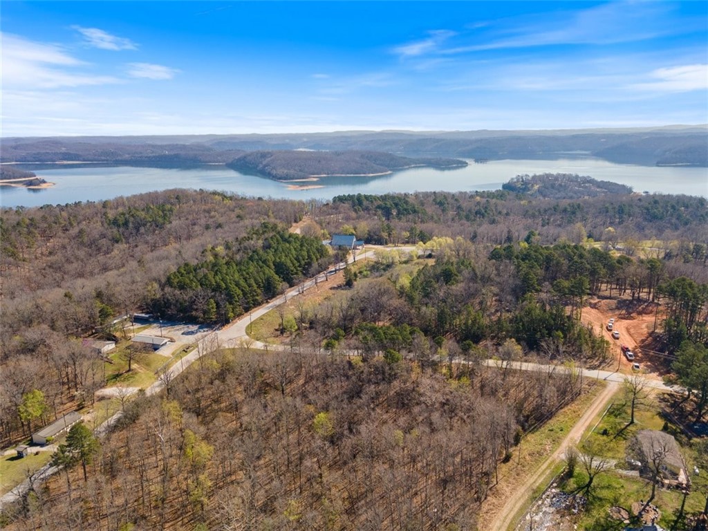 Discover an incredible opportunity with this 14.55-acre parcel nestled in the heart of Rocky Branch, just moments from the renowned Rocky Branch Marina & Campground. Ideal for resort property, this prime land comprises a total of 20 lots, tailor-made for your dream vacation homes or cozy cabins, offering unparalleled proximity to the stunning Beaver Lake. With its lush, wooded lots and immense development potential, this property is a true gem waiting to be claimed by savvy investors and discerning buyers alike. Enjoy easy access to hiking and biking trails, as well as the nearby Hobbs State Park. Secluded from city life yet conveniently just 15 minutes from vibrant Downtown Rogers, don't miss out on this chance to turn your vision into reality in one of the most sought-after locations!