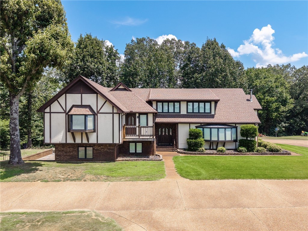 Welcome to a once-in-a-lifetime opportunity to own this extraordinary 124.56-acre estate, where timeless character meets unmatched outdoor luxury. At the heart of the property sits a stunning Tudor-style home, rich with classic architectural details, offering a warm and inviting retreat. Step outside to enjoy your own private resort, complete with an in-ground pool and charming pool house, (with a full kitchen, laundry, and bathroom), this space is perfect for entertaining or relaxing in style. For the golf enthusiast, enjoy the five irrigated golf greens. Two serene ponds and a winding creek add to the property's natural beauty, while a comprehensive irrigation system—sourced from one of the ponds—keeps the grounds lush year-round. With wide-open pastures, and multiple access points, this property is ideal for a working ranch, equestrian estate, or a private recreational haven. Embrace a lifestyle of tranquility, prestige, and outdoor adventure—all in one breathtaking location.