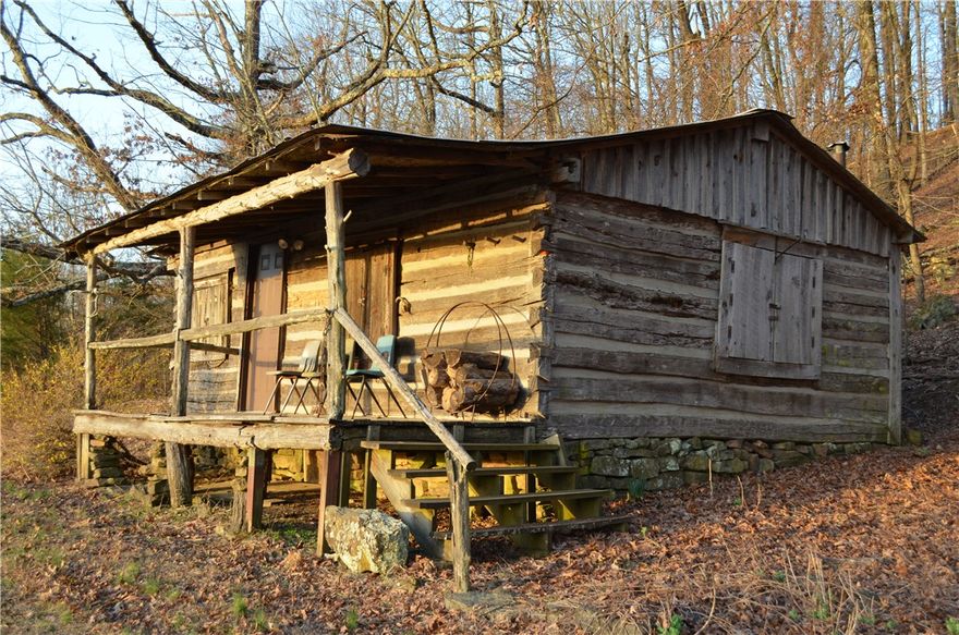 Do you want to be off the grid?  Do you enjoy outdoor recreation such as hiking, biking, canoeing and numerous waterfall adventures and beautiful views?  Unique recreational property!  1870's log cabin with 432 square feet that faces in eastwardly direction.  Second building is a two-story structure with 384 square feet on the first level.  3.58 acres.  Close to Ozark National Forest, Arkansas Natural Bridge, Boxley and Ponca Valleys, Pedestal Rock, King's Bluff, Hawksbill Craig, Buffalo and King Rivers and more.  Forty miles of bike trails.   Public water and two wells on the property.  Needs septic system.  See the following link for septic ideas: https://share.google/fmjUJuZRzt6ljzm5a or ask agent for more information.  MOTIVATED SELLER!!!
