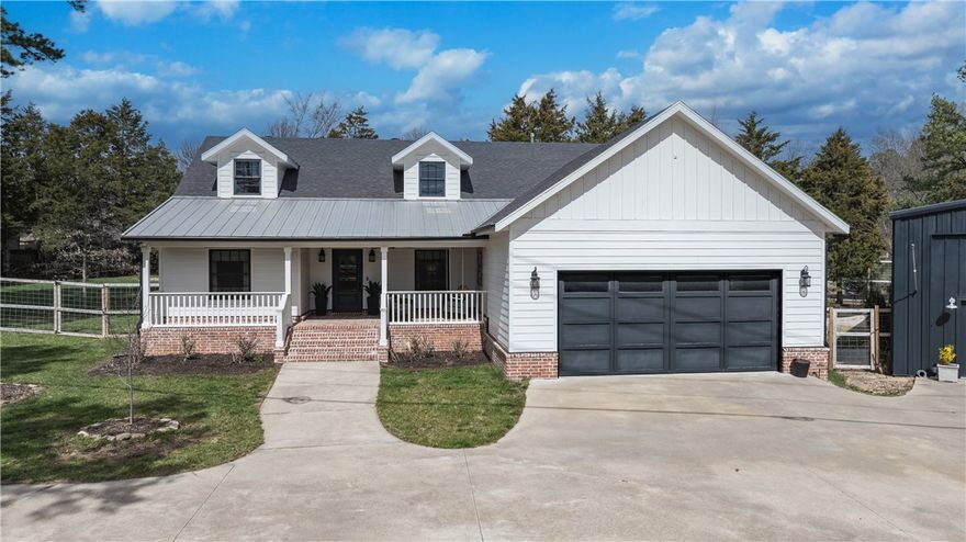 Exquisite home is the perfect blend of luxury, comfort, and practical elegance with thoughtful high-end designer touches throughout. A spacious open floorplan features custom built-ins, striking fireplace, & beautiful shiplap accents. Kitchen has a center island, sleek countertops, stainless appliances, & butler’s pantry. Home office perfect for work or study. Master bedroom is serene & generously sized; en-suite bath has a tiled steam shower.  Beautiful lighting fixtures & thoughtfully chosen finishes elevate this home’s aesthetic. 
This impressive 2,400 sq. ft. detached building (40'w x 60'd) offers a versatile space that combines comfort & function. Building is equipped with A/C throughout. Kitchen area has butcher block countertops, double sink, dishwasher, electric for a refrigerator & plenty of space for storage. Loft with two beds & full bath adds a unique touch. Space also includes a 9'x12' laundry area; tankless water heater, & air filtration system. Property is gated. Yard is irrigated & fully fenced.