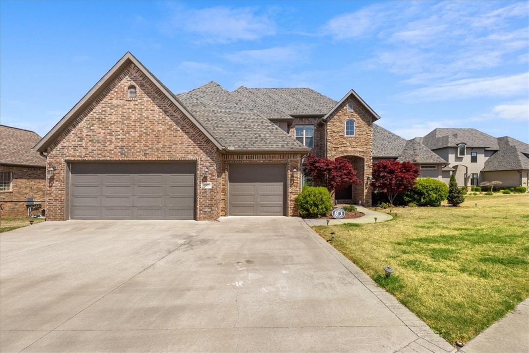 What if your morning coffee came with sweeping golf course views? Welcome to the lifestyle you've been waiting for. Rogers' most sought-after neighborhood Shadow Valley Country Club. This 5-bed, 4.5-bath home offers the perfect layout for family living with 2 bedrooms + office on the main level, 3 bedrooms + bonus room upstairs, nearly 4,000 sq ft of space and a 3 car garage!
The open-concept design is filled with natural light, tall ceilings, and rich hardwoods.
Break bread in this chef’s kitchen with high-end appliances, a six-burner gas range, double ovens, granite countertops, a mini fridge, and an oversized fridge. Step outside to a covered veranda with awesome views of the 7th hole! Your next chapter starts here.
