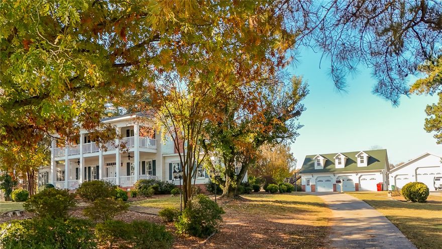 The minute you start down the narrow, tree-lined lane w/ immaculate pastures stretching off to your right—the anticipation builds. You just know that something remarkable is waiting at the end. And then, there it is...A 2 story Colonial home rising proudly in the distance. The wonder only deepens as you take in the Southern-columned front porch and balcony, the gleam of solid oak floors, the cherry-paneled den crafted at the turn of the century—every corner whispering a story. Set on 335 acres, this property offers an unmatched blend of history and modern functionality. The 4,447sq ft home anchors the estate with timeless elegance, while the guest house provides lodging for family & friends. The farm includes 2 detached, heated & cooled, 3-car shop/garages, perfect for equipment, hobbies, or storage, as well as a barn with tac room & office. There's also a vintage log cabin placed on the property like a scene from a storybook—ideal for a studio or office. Fenced pastures & open skies surround you in every direction