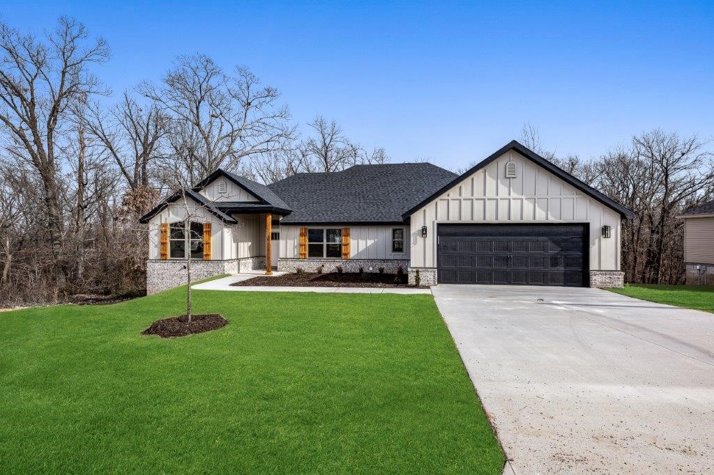 Brand new Bella Vista Beauty sitting on a .32-acre lot! 3 bedroom+flex room/2 bath home featuring the builders most popular plan including an open concept with split bedrooms. Boasting lots of natural light, high-end quality finishes: hardwood floors in living and dining area, gas log fireplace, granite countertops, pantry & custom cabinets. Spacious primary suite has a spa like bath with double vanities, custom tile shower & separate free-standing tub. Primary closet connects to laundry room. Enjoy time on the covered deck that overlooks nature. Generac transfer switch already installed. ($1k value) $0 down payment, 100% financing, rural development loan available. $5000 towards rate buy down or closing costs with builders preferred lenders.