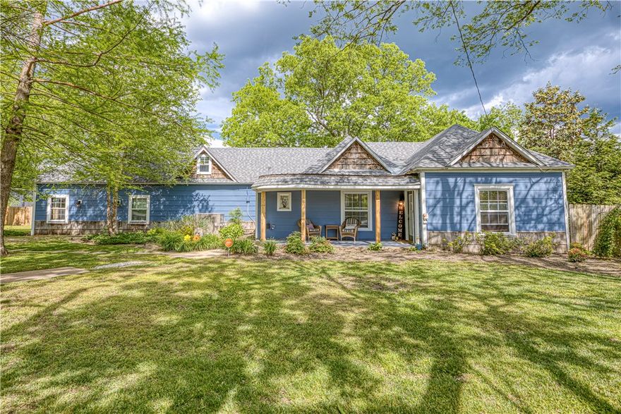 Big house in the heart of town! 5 true bedrooms with 2 good size converted attic rooms. Two master suites and the second could be used as MIL suite or as a rental with exterior access and it's own kitchenette. Living spaces include large dining room open to living room. The kitchen also includes adjacent room that could be den or dining room. 

Full wooden privacy fence encloses the back yard with a chicken coop and detached garage. TOO many patios and outdoors spaces to list! Pool house includes a kitchenette, bar and pool table. Pool is older and ready for a refinish, however, it still holds water well and structurally sound and includes a new pump! New roof on house and pool house in 2025! There are so many opportunities with this house.