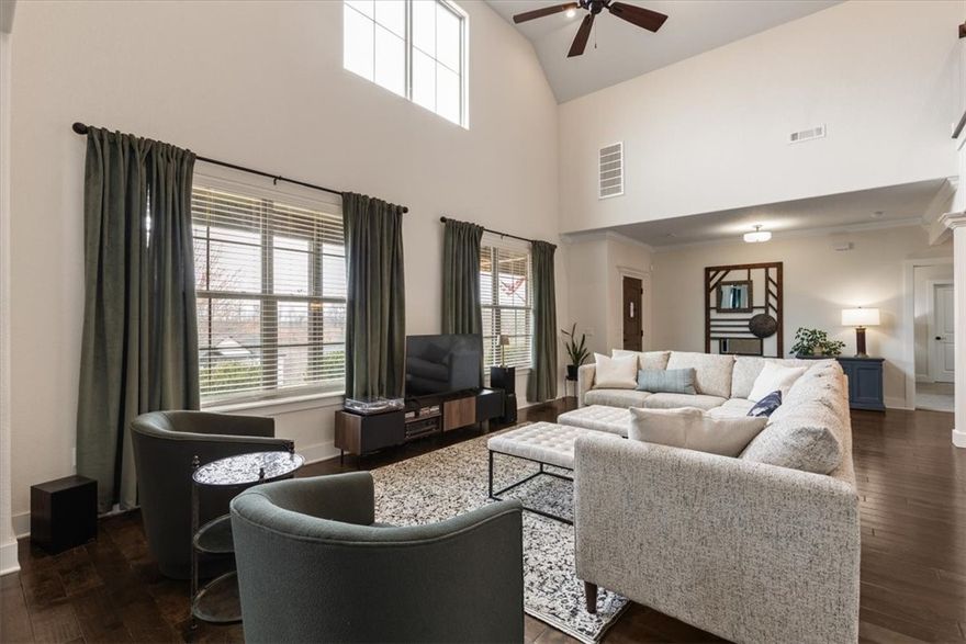 Searching for the perfect blend of comfort, convenience & outdoor adventure, look no further than this home in Grammercy Park. Situated just 8 minutes from Walmart Campus & renowned Crystal Bridges Museum, this location offers an exceptional lifestyle coveted by many. Lovers of mountain biking have the Hand Cut Hollow Mountain Biking Trail conveniently connected to the neighborhood. Plans for a direct road to Tiger Blvd begin soon. Additionally, the Slaughter Pen Mountain Biking Trailhead is minutes away. Inside you'll find inviting spaces with room to spread out. You'll enjoy cooking in the well equipped kitchen & 2 large pantries. The primary bedroom is on the main level, a luxurious bathroom & a powder room for guests. Upstairs, 4 more bedrooms & storage. Back outside is a front porch with amazing views from the swing or a back patio, storage room & fenced yard. New roof 2024, new luxury carpet in the bedrooms 2025. A 3 car garage on flat ground at the back. Refrigerator, washer, dryer & porch swing included.