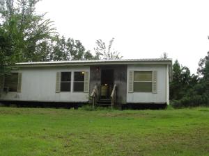 View of mountains, nice metal shop. Excellent buy for a doublewide. Mobile needs carpet